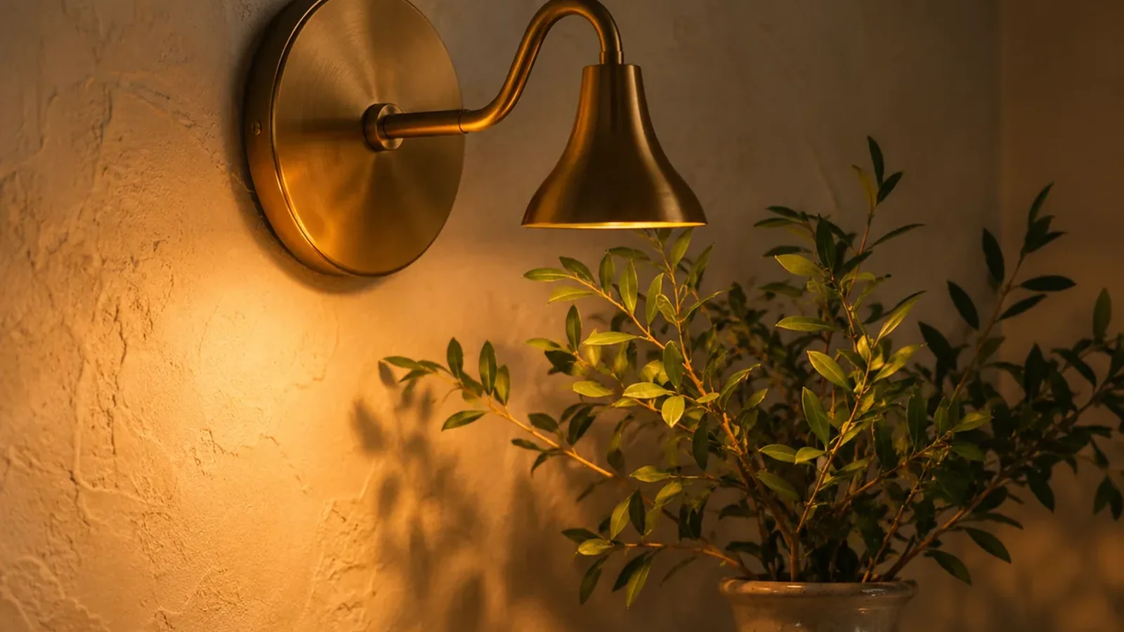 Warm lamp light in a calm cozy room with candle glow and soft decor